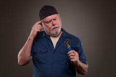 http://www.dreamstime.com/stock-images-confused-mechanic-spanners-holding-spanner-looking-image30489944